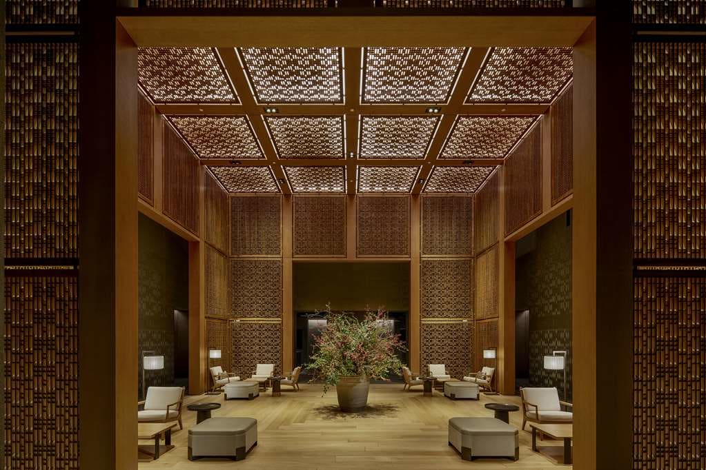 Amanyangyun lobby with intricate wooden lattice screens and warm lighting