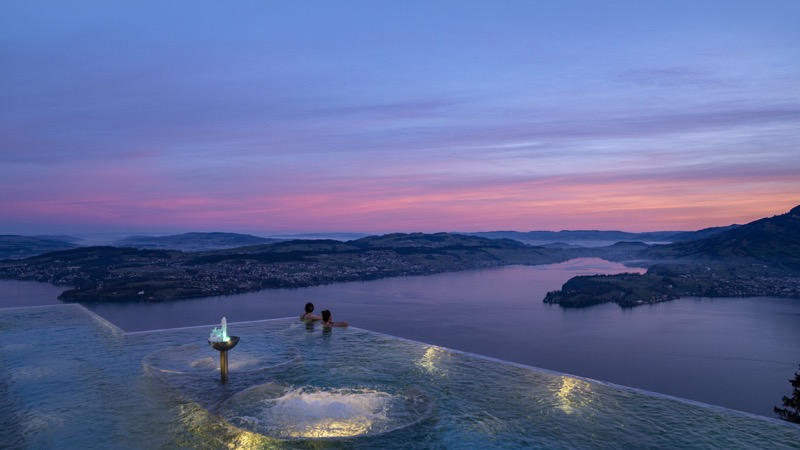 Bürgenstock infinity pool overlooking Lake Lucerne at sunset